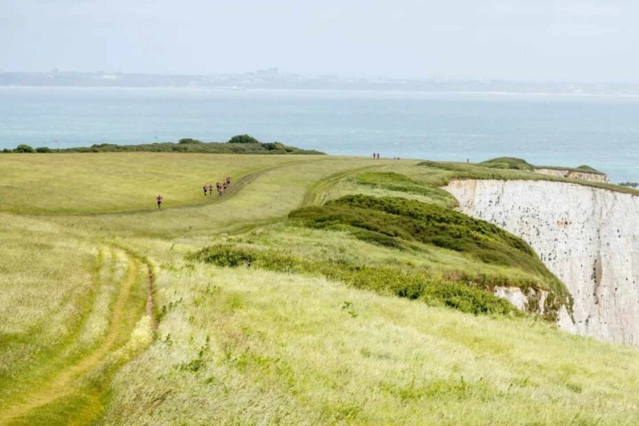 swimrunners in stunning coastline around Studland near Old Harry's Rocks